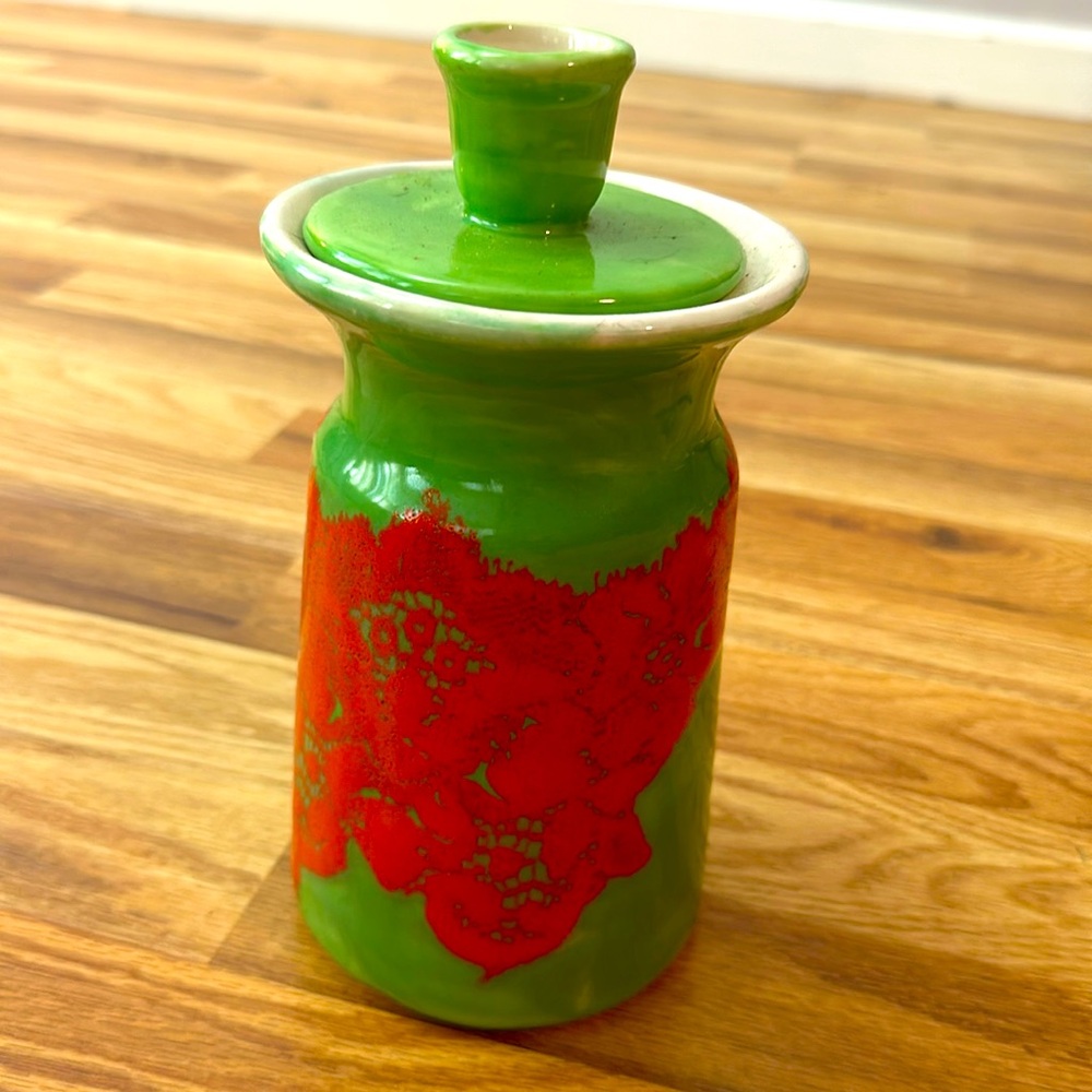 Green and orange ceramic canister with lid